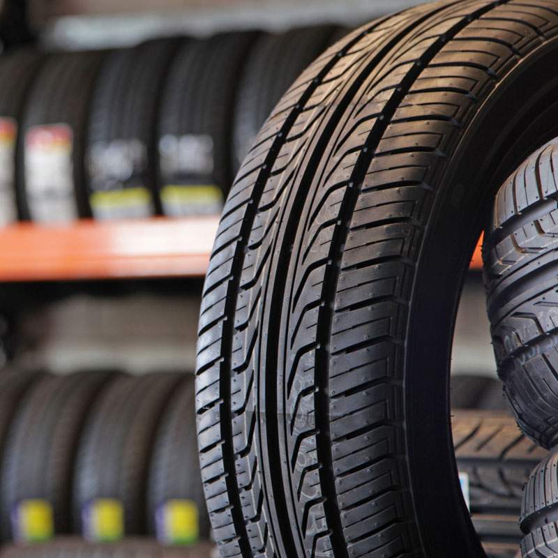 tire with rack of tires in background